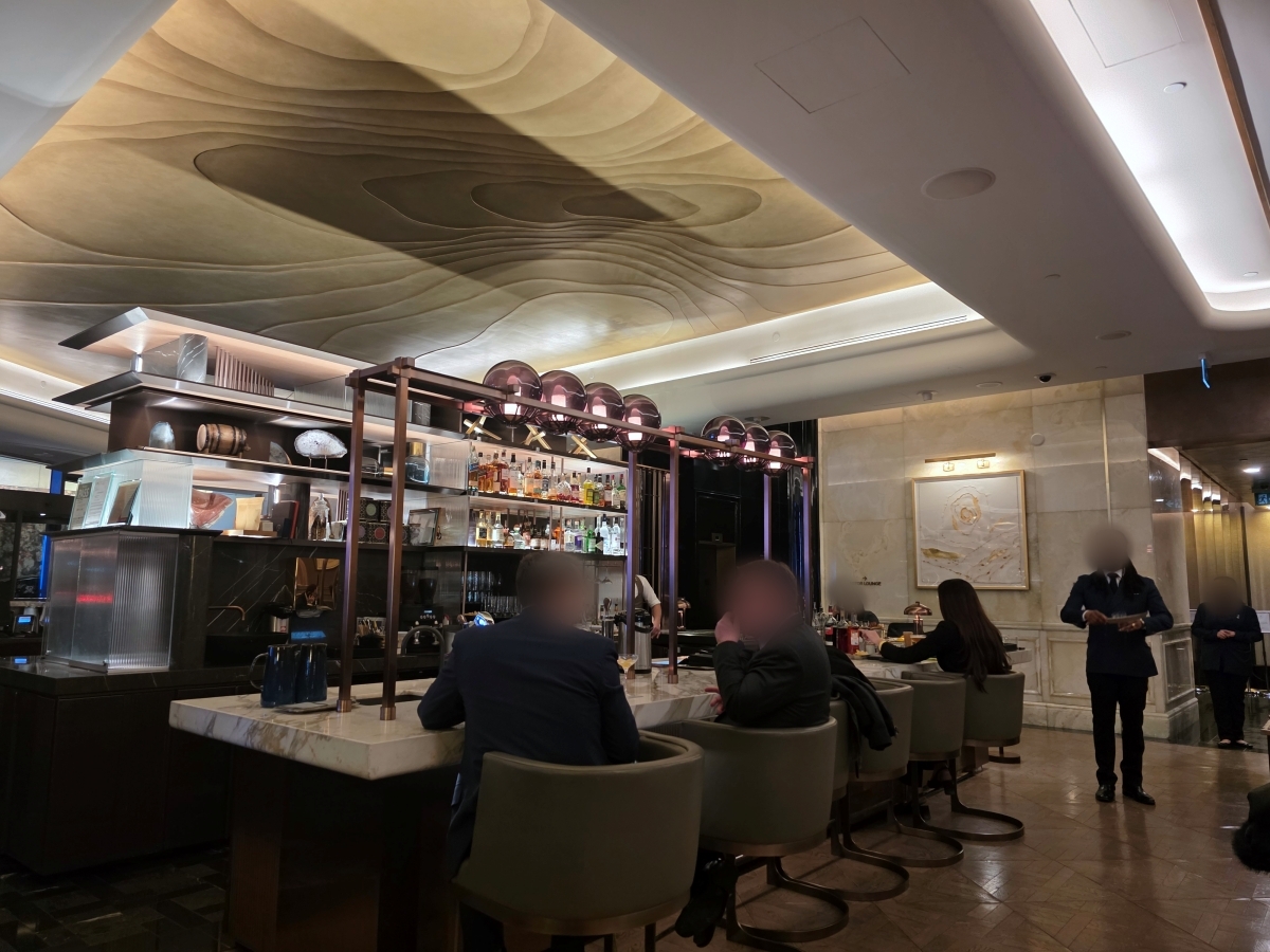 Comfortable lounge seating area in the restaurant with guests socializing