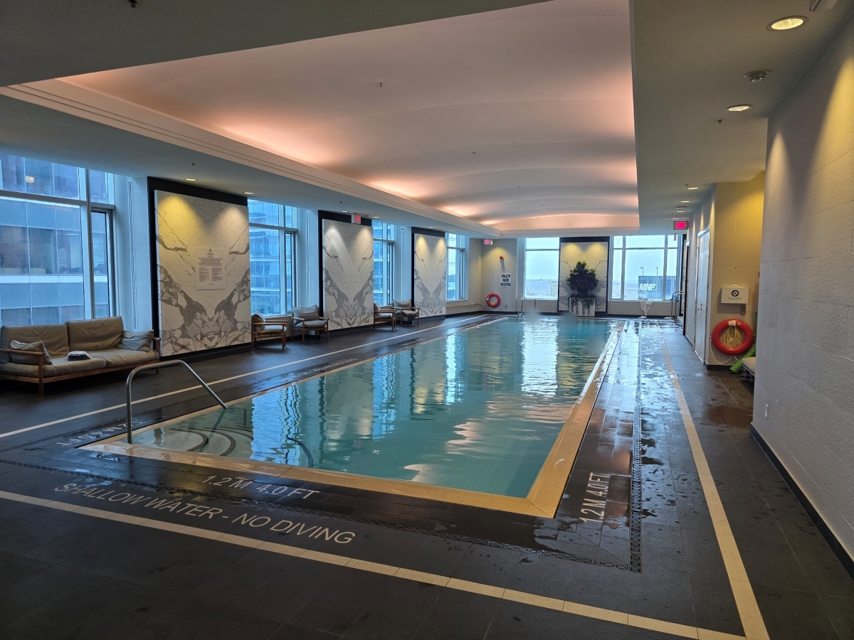 Large indoor lap pool with infinity edge at The St. Regis Toronto