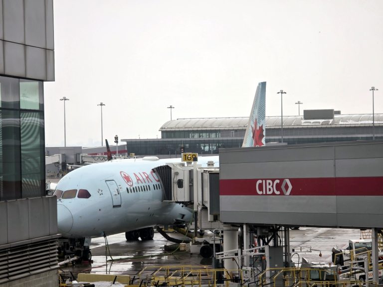 Air Canada aircraft seen from the Maple Leaf Lounge at Toronto Airport