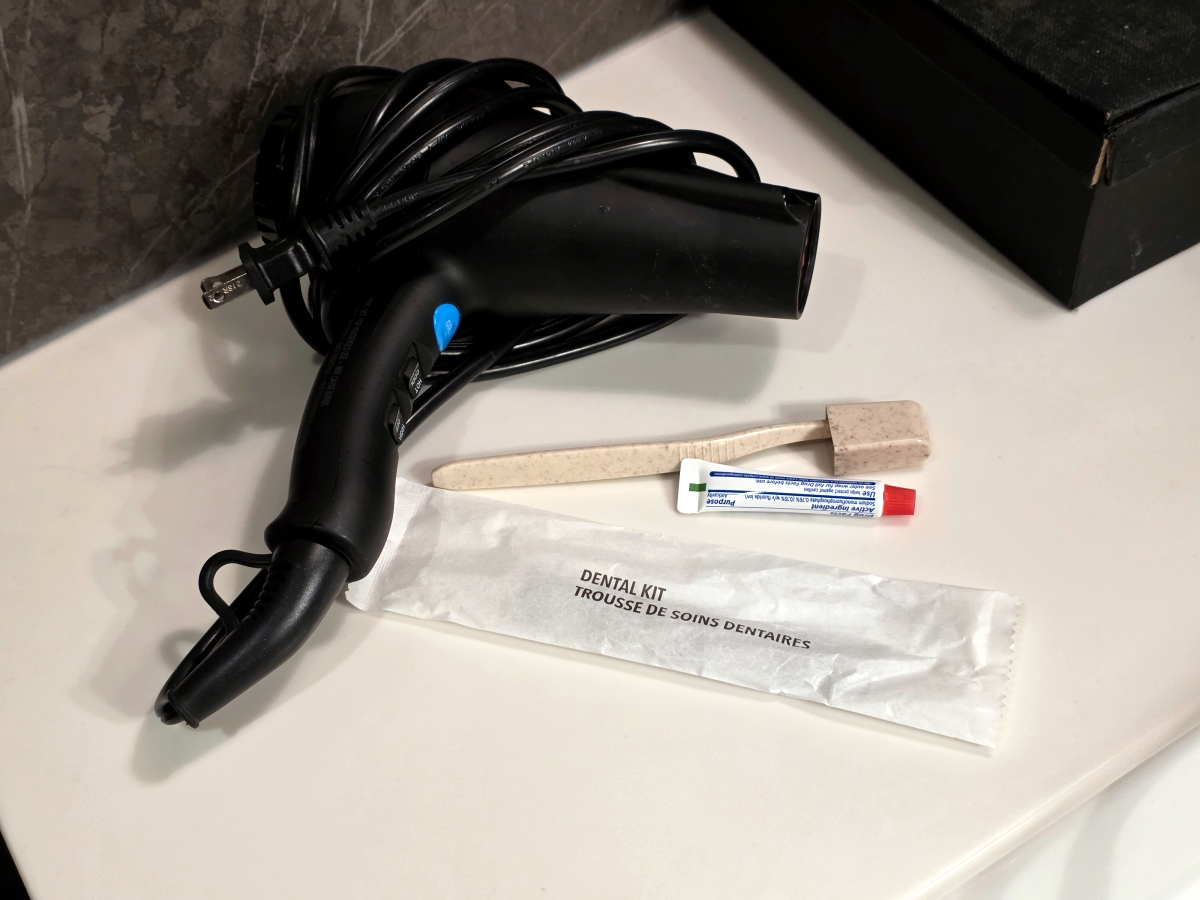 Hair dryer and dental kit provided for Maple Leaf Lounge shower users