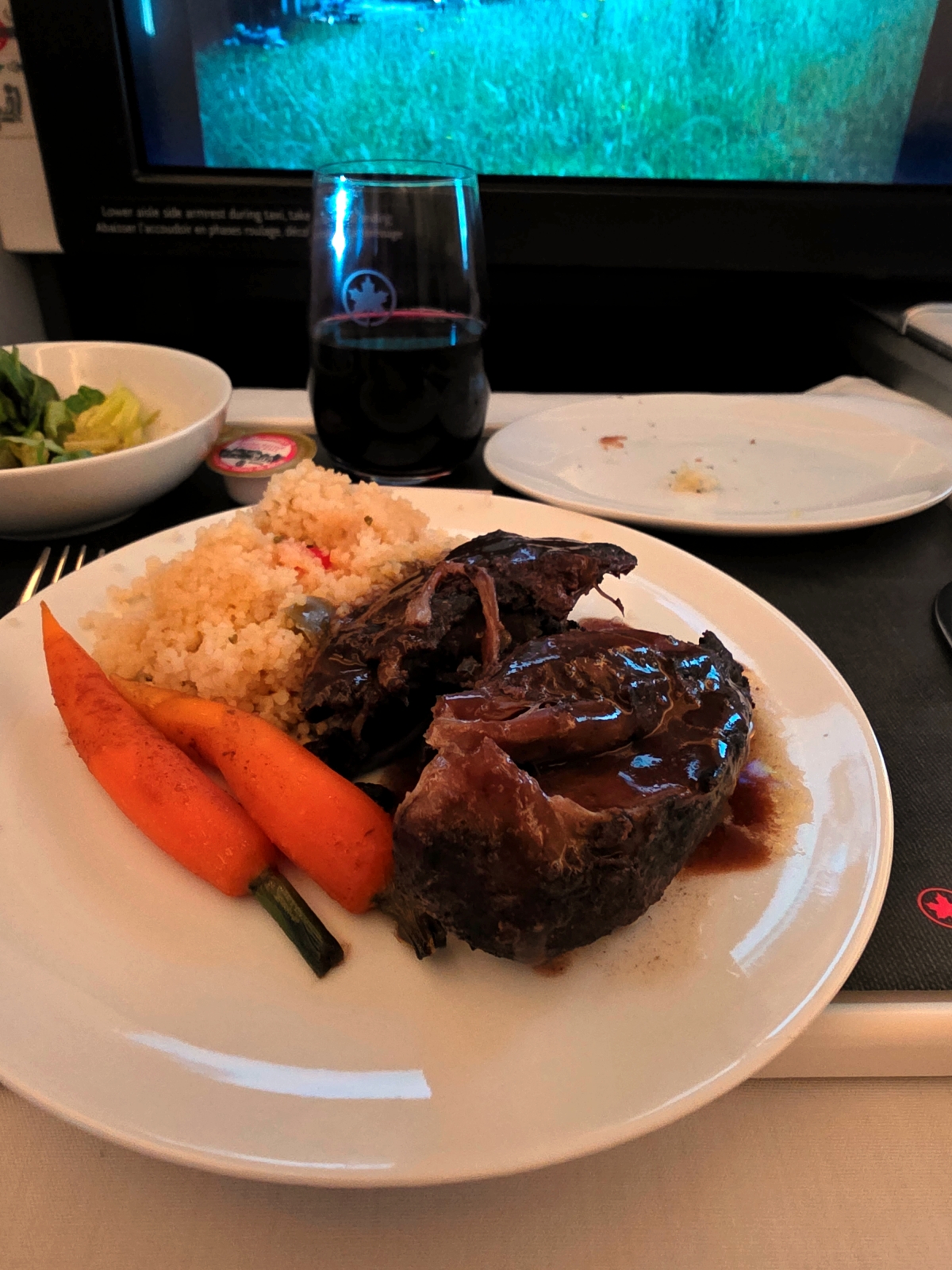 Braised lamb shank main course in Air Canada Business Class
