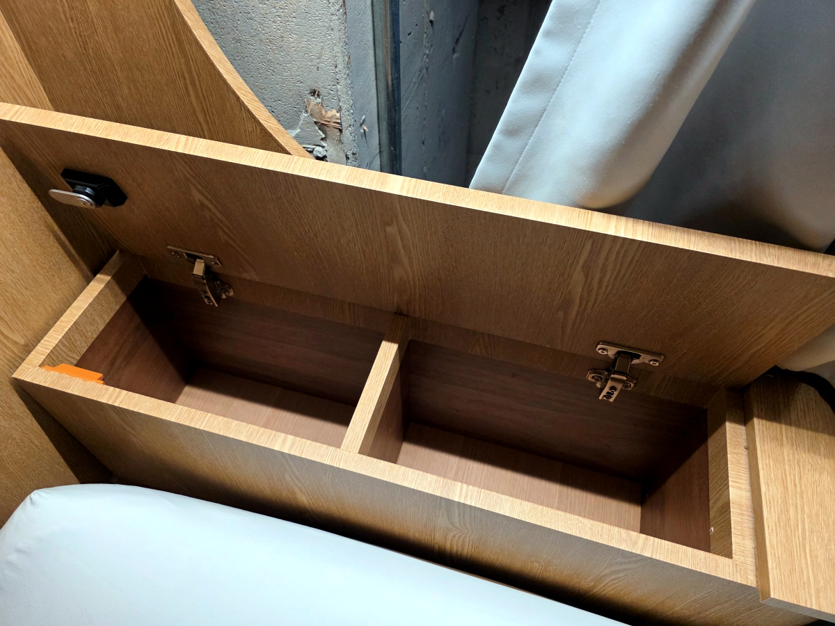 lockable storage compartment inside capsule