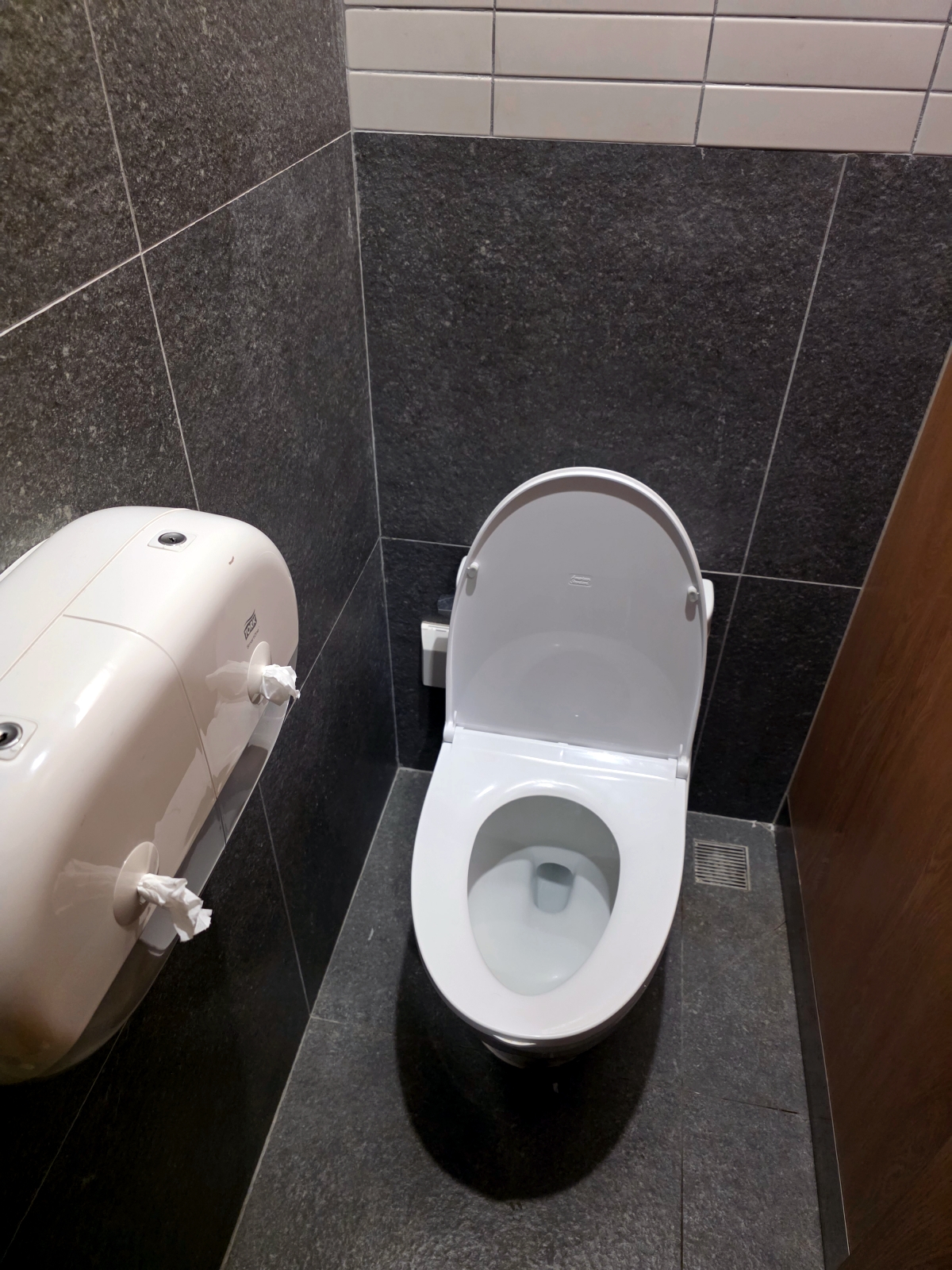 men bathroom urinal at capsule hotel