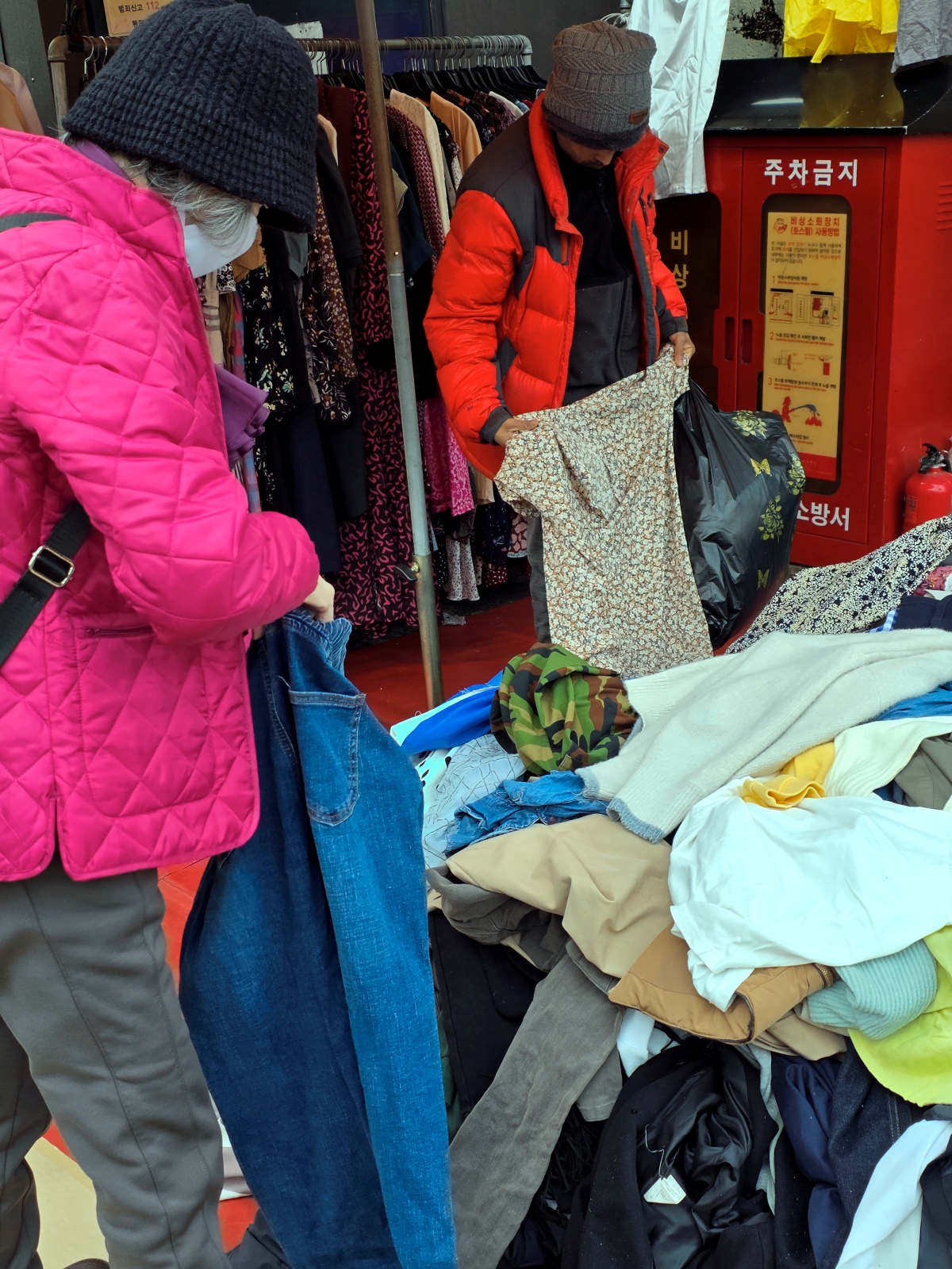 people shopping clothes at dongmyo flea market