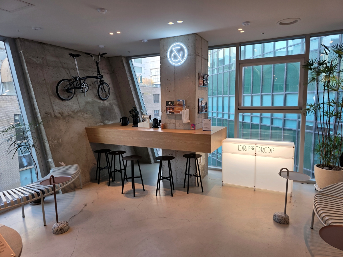 common lounge seating area at capsule hotel