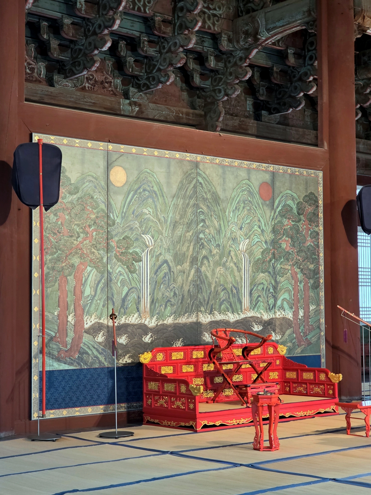 Interior of a palace hall showing traditional royal seating