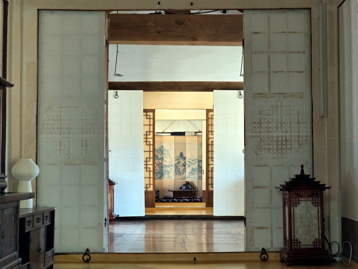 Open paper doors connecting Hanok rooms