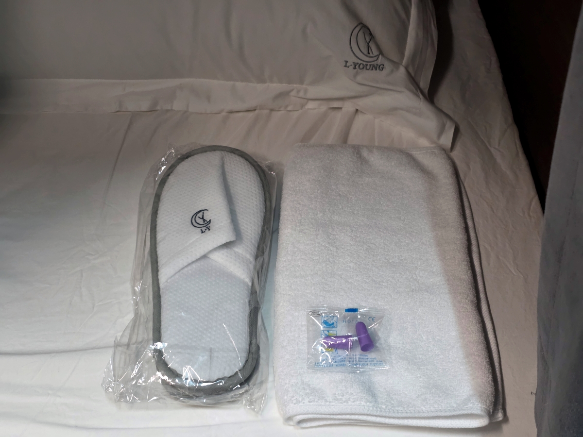 Slippers and earplugs provided at capsule hotel
