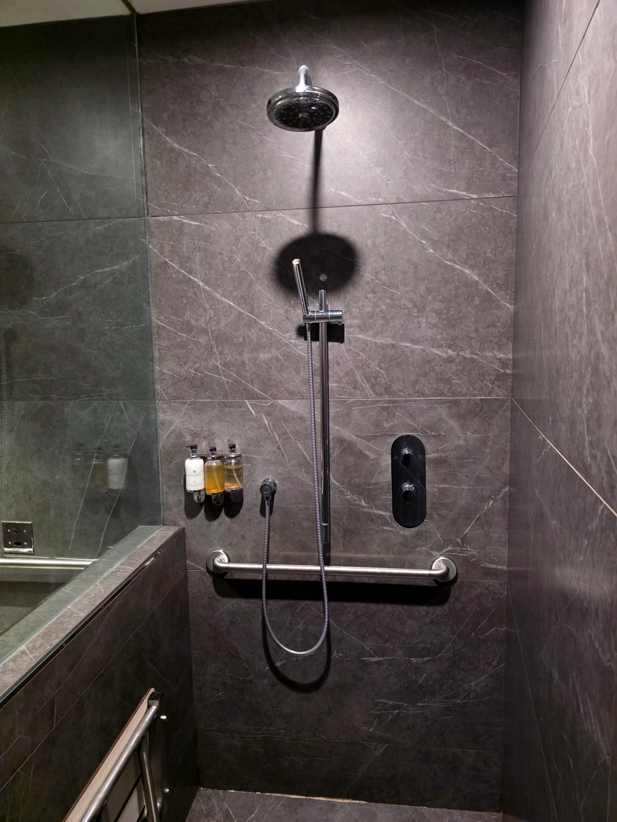 Glass shower booth inside the Maple Leaf Lounge shower facility at YYZ