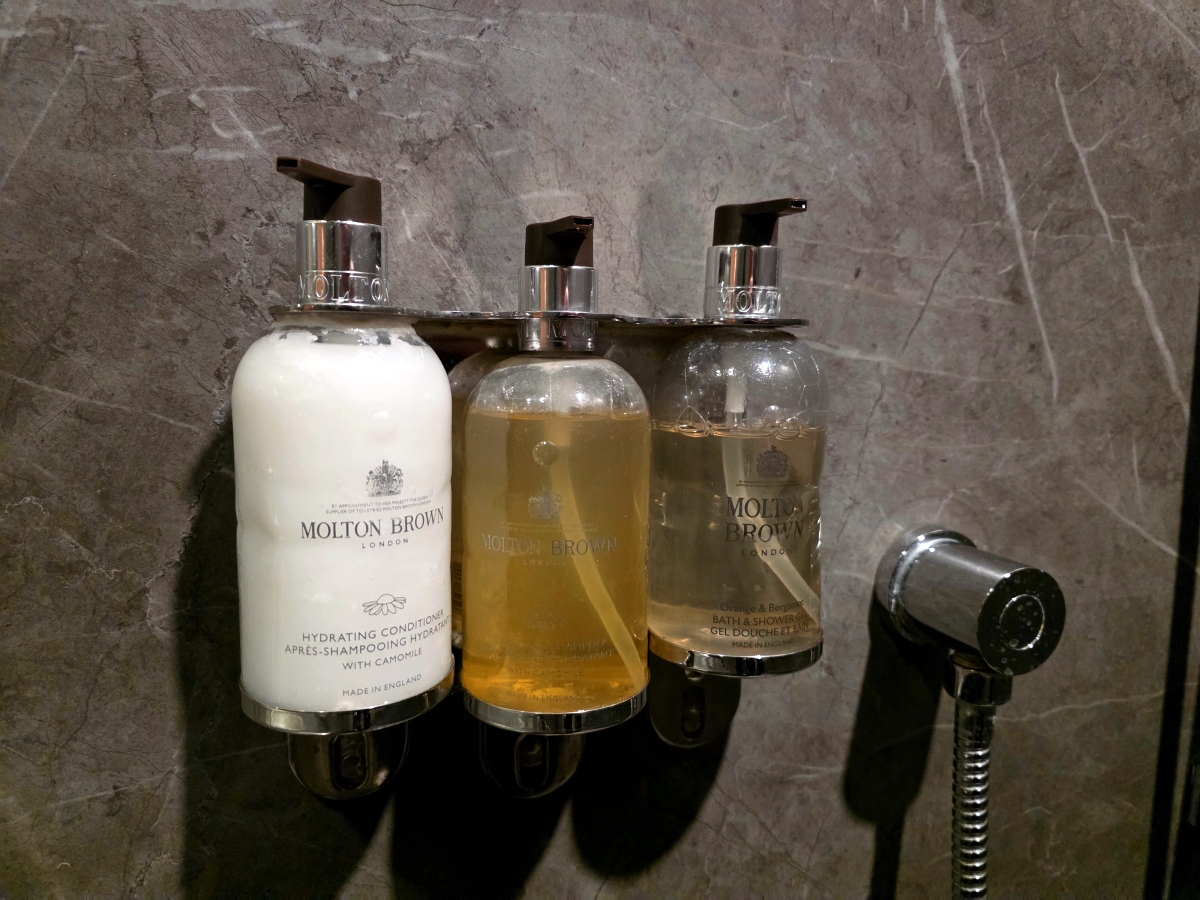 Molton Brown shampoo and body wash in the Maple Leaf Lounge shower booth
