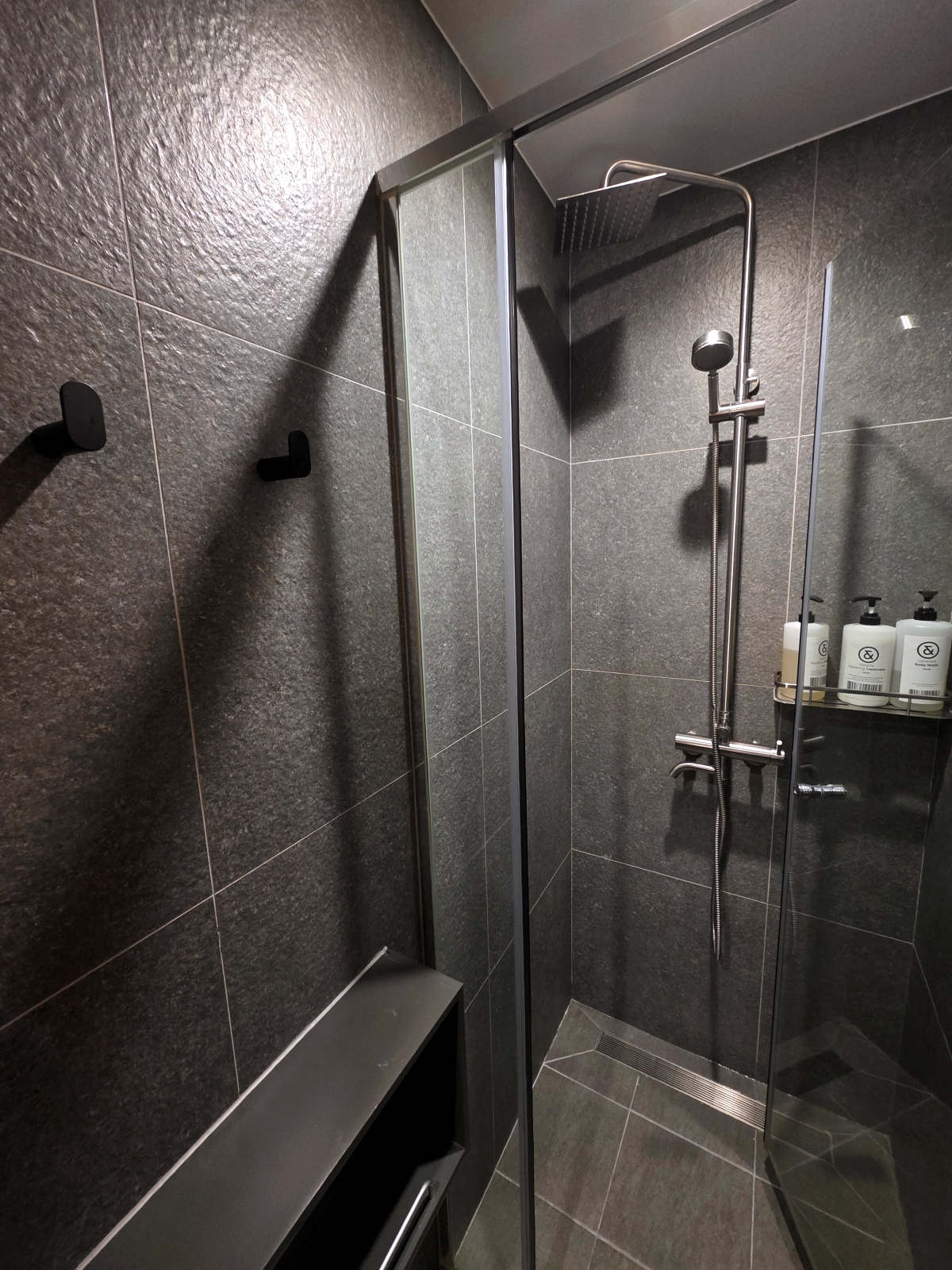 shared shower room at drip drop capsule hotel