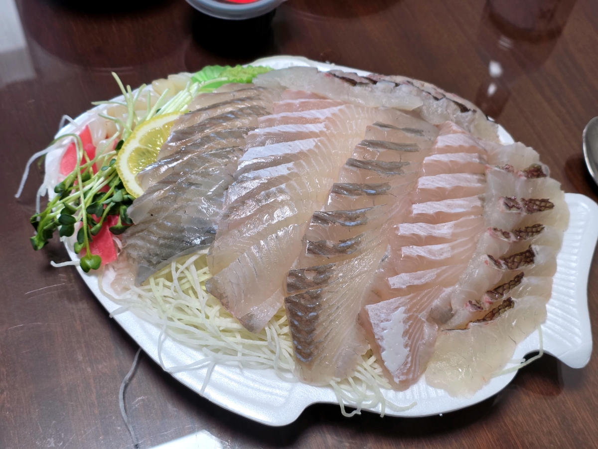 Flounder sashimi 50000 KRW with extra sea bream at Seoul fish market Noryangjin