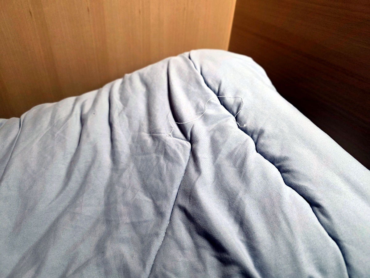 bedding inside capsule hotel