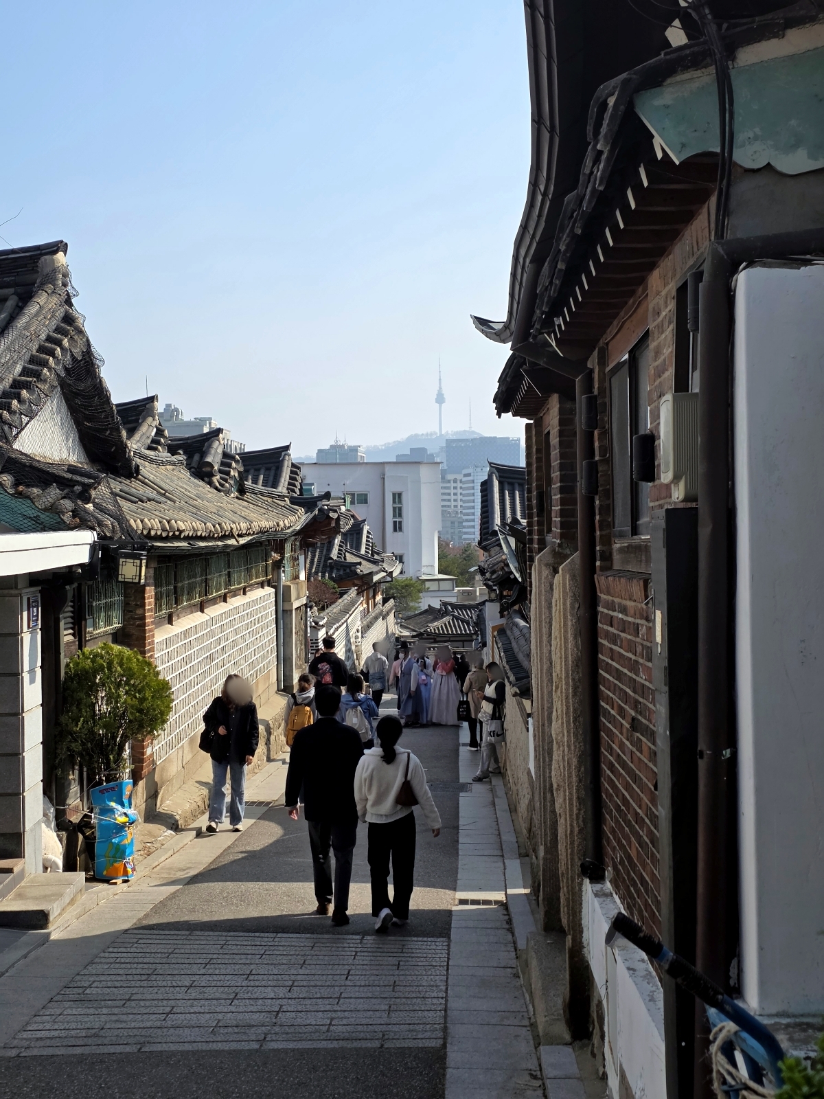 Hanok rooftops with N Seoul Tower in the distance in Bukchon