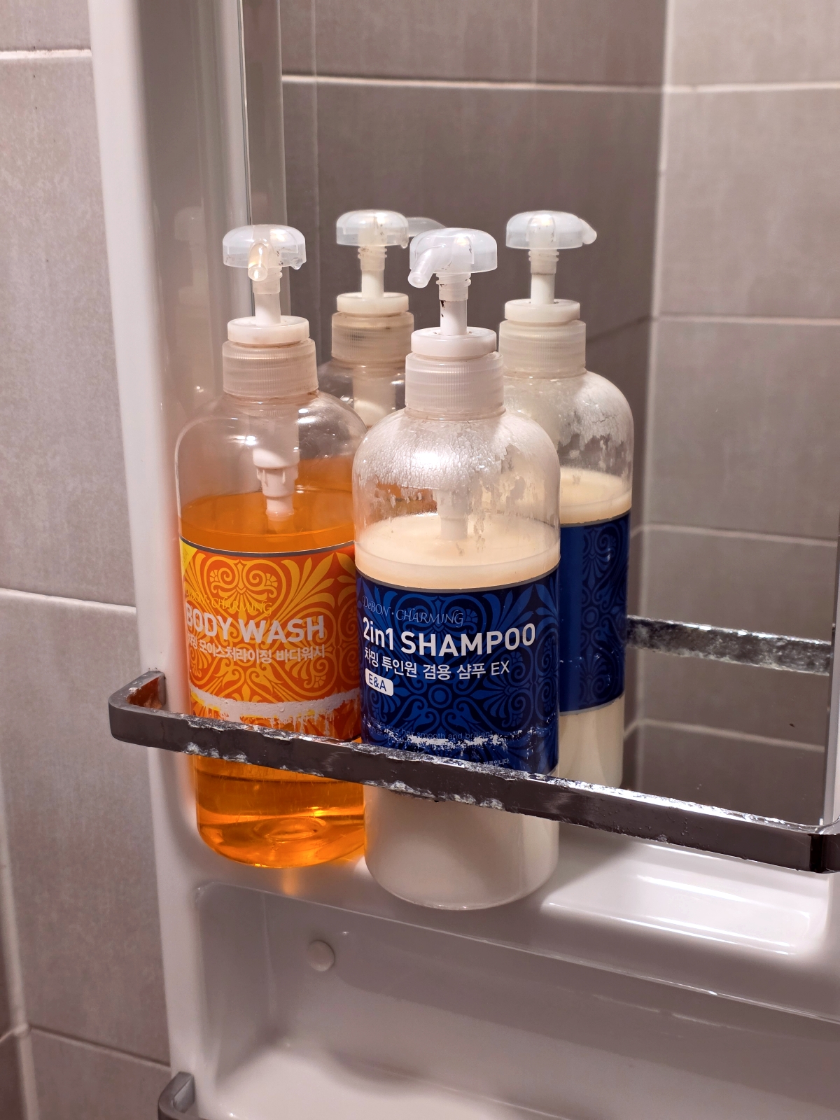 mold on amenity dispensers Step Inn Myeongdong bathroom