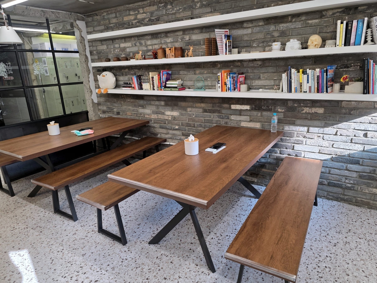 Large dining table at The Cube Hotel Myeongdong common area