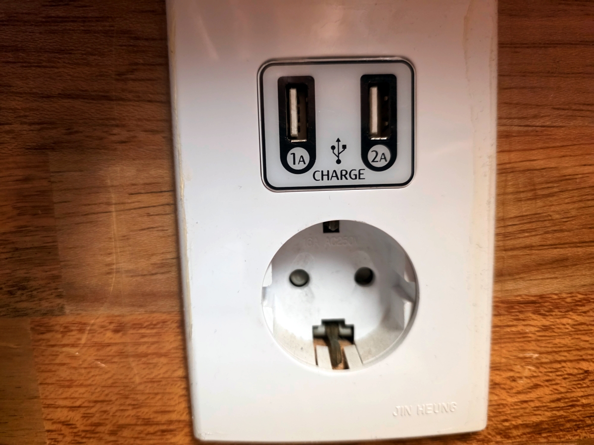 Power outlet inside capsule at The Cube Hotel Myeongdong