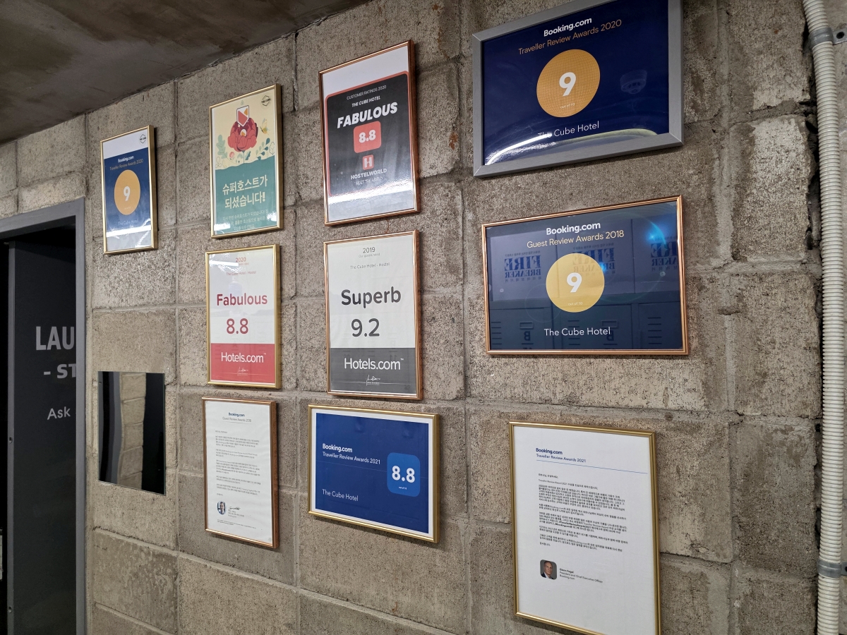 Award certificates displayed in hallway at The Cube Hotel Myeongdong
